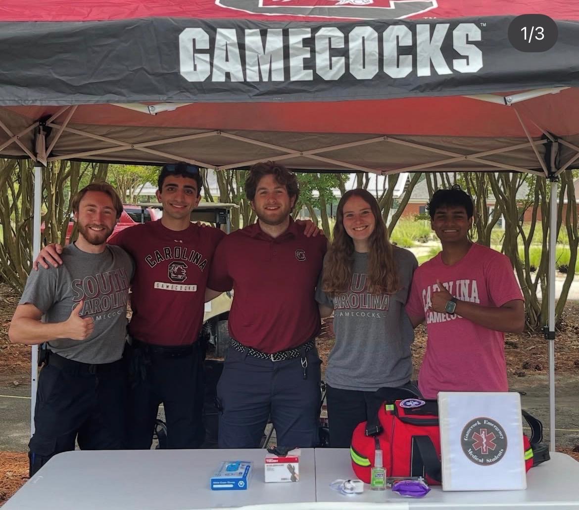 Gamecock EMS members staffing a first aid station under a Gamecocks tent