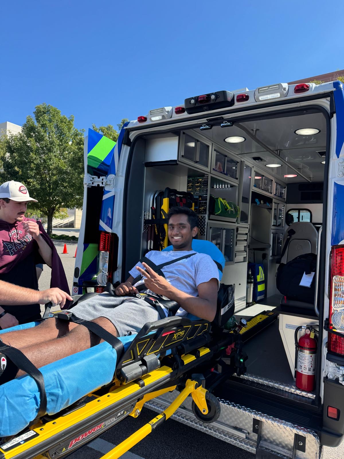 Gamecock EMS member on an ambulance stretcher during training