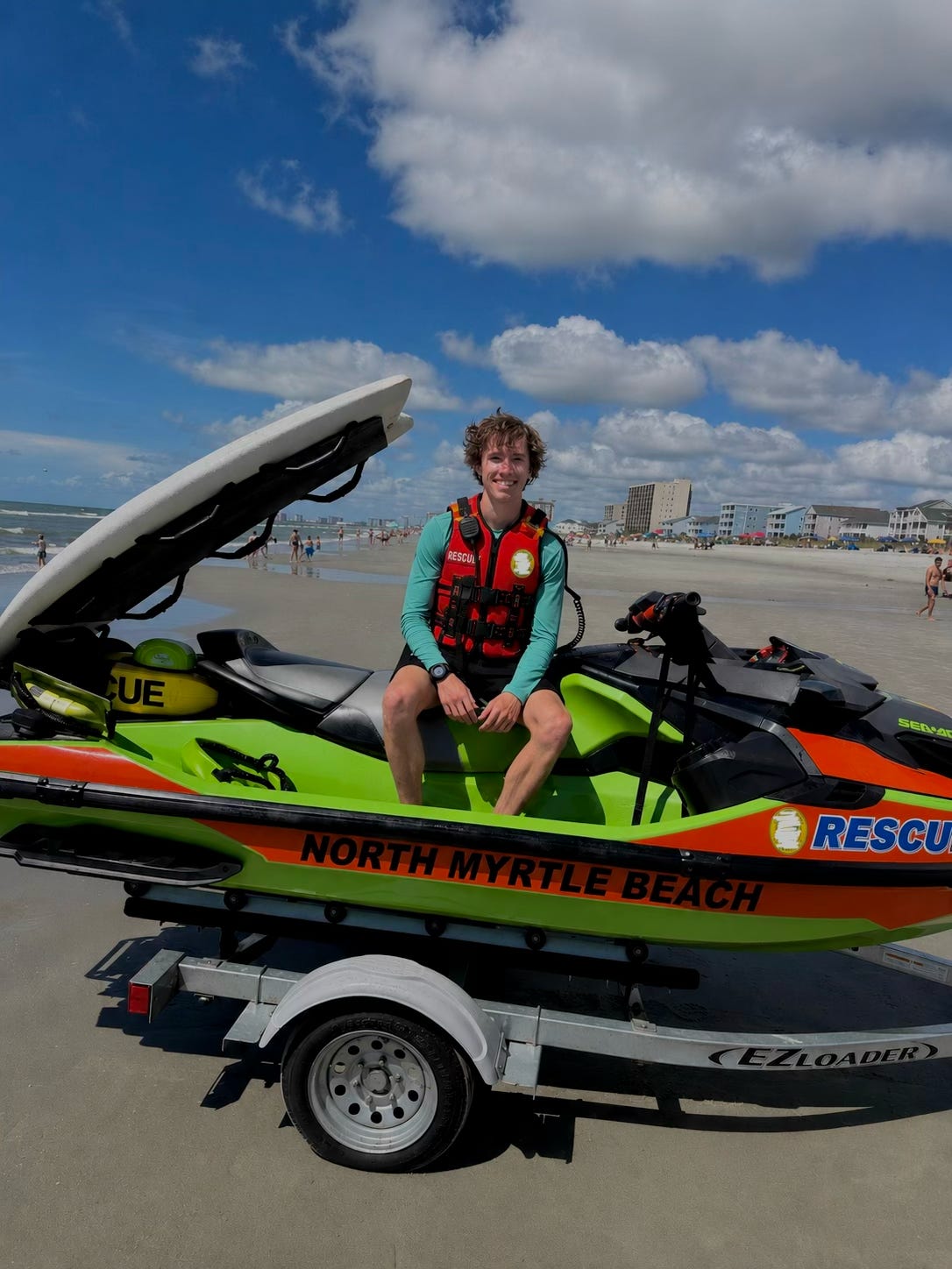 Member with a beach rescue watercraft